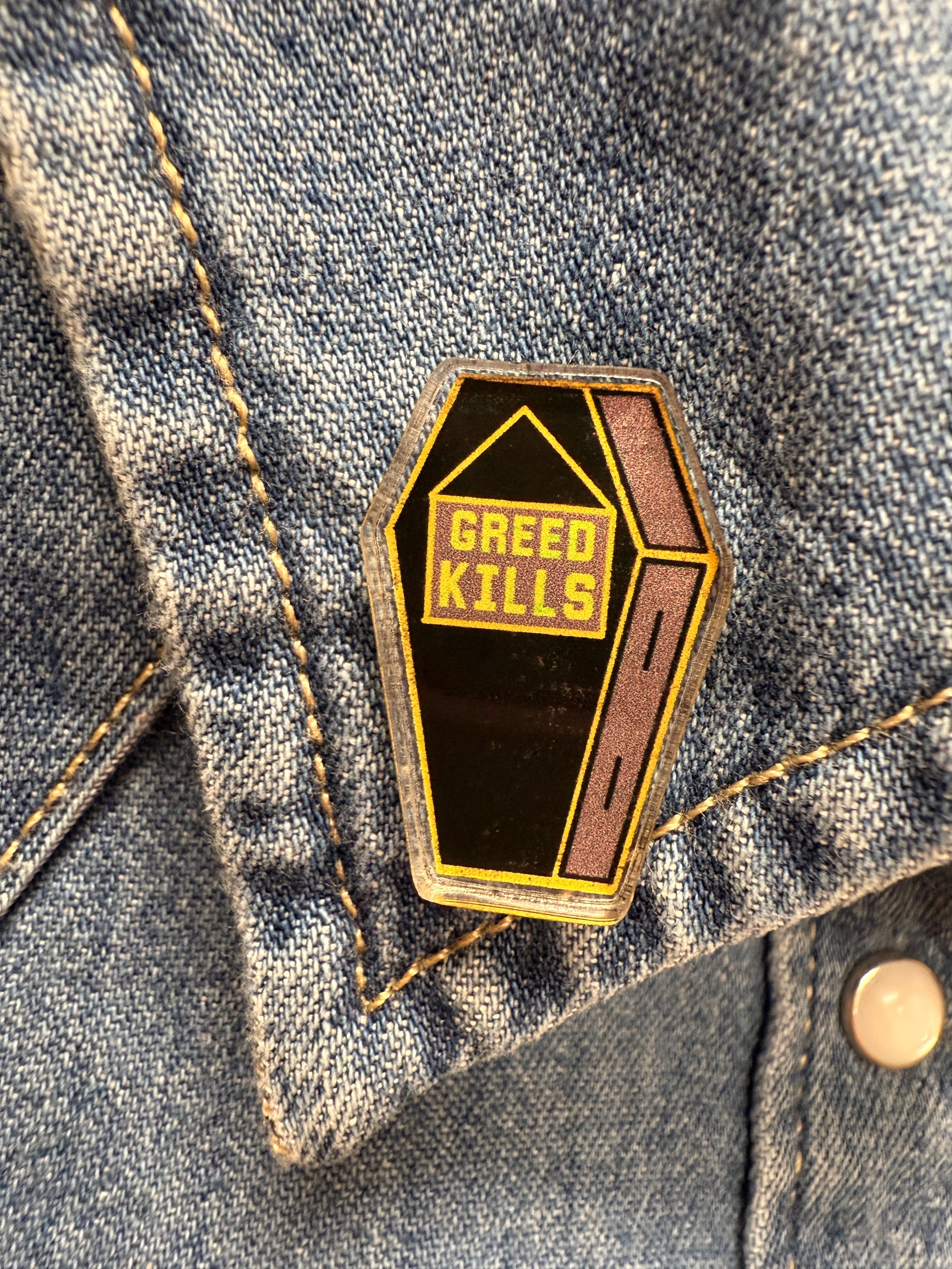 Greed Kills Coffin Acrylic Pin