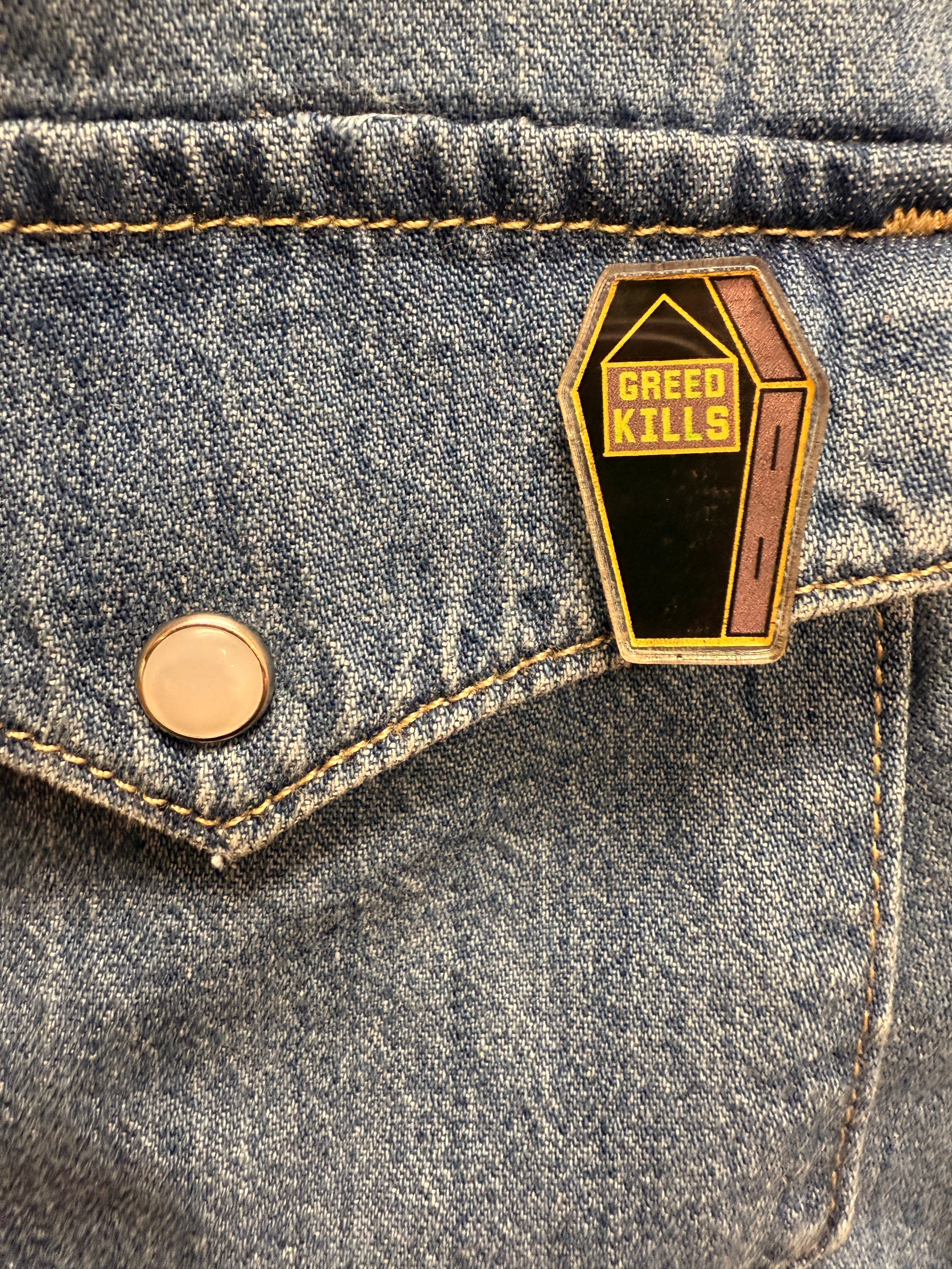 Greed Kills Coffin Acrylic Pin