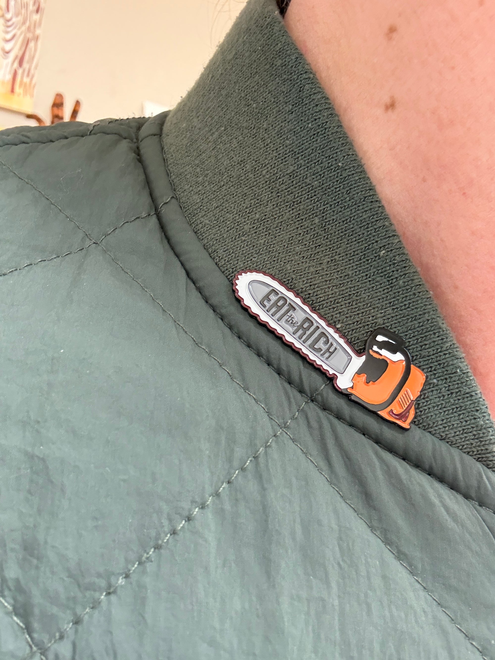 Chainsaw of Democracy Eat the Rich Enamel Pin