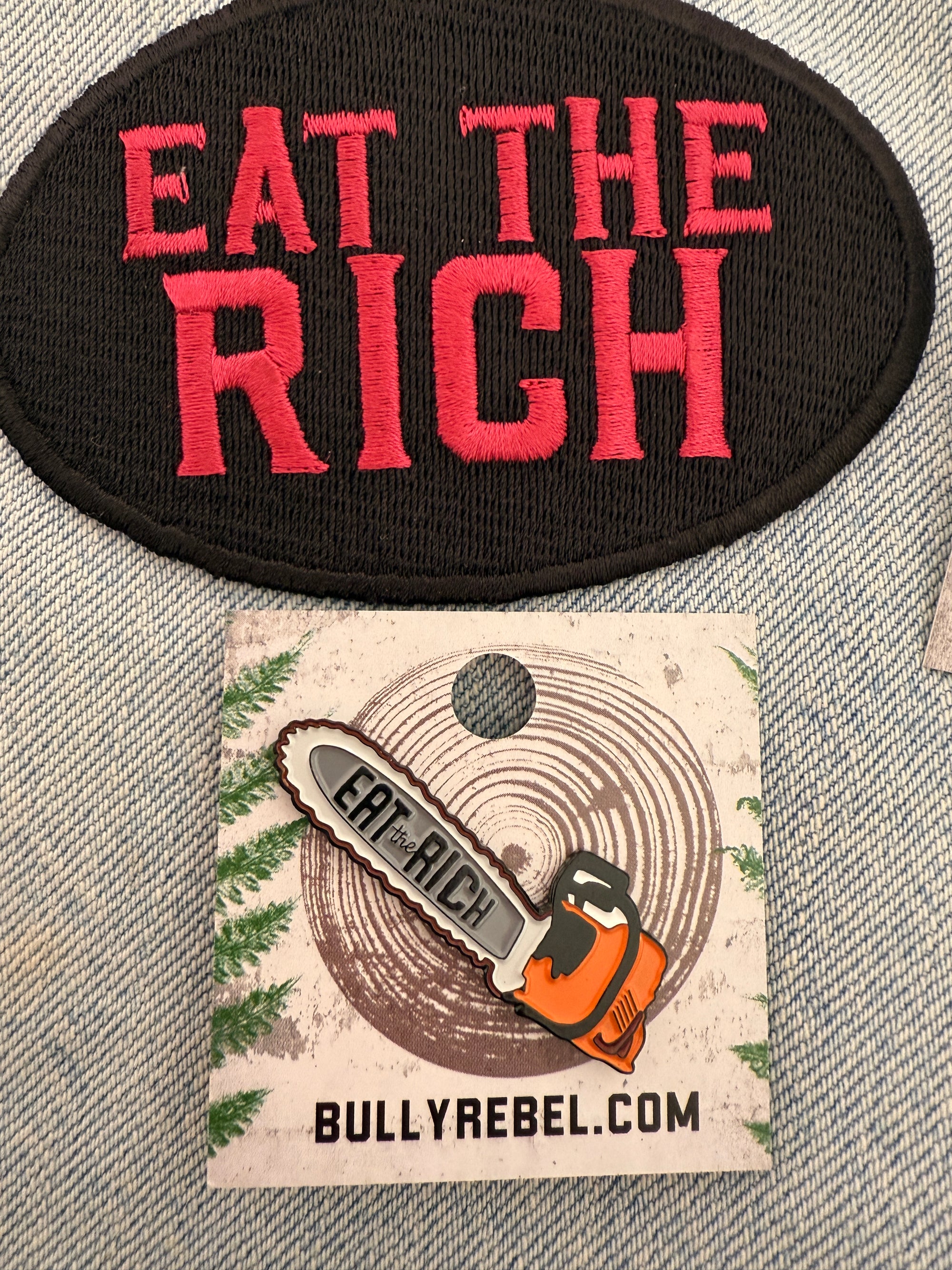 Chainsaw of Democracy Eat the Rich Enamel Pin